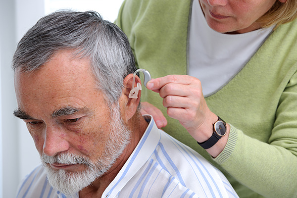 an older gentleman wearing a hearing aid